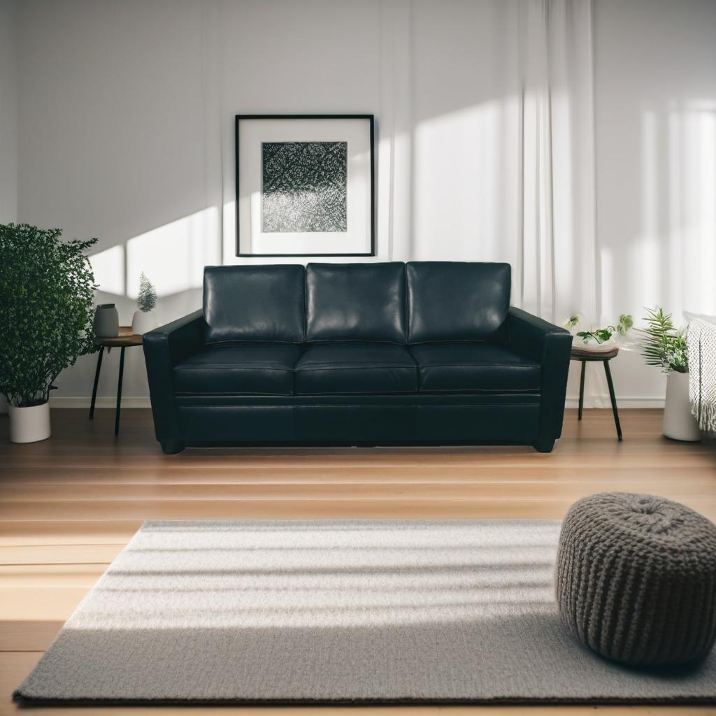 A sleek, modern black leather sofa sits in a bright, minimalist living room. The space features white walls, wooden floors, and a neutral area rug, with green plants on either side of the sofa. A black-and-white abstract artwork hangs above, creating a calm and sophisticated atmosphere.